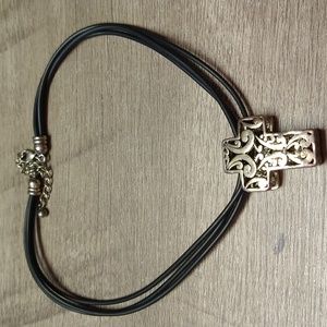 Silvertone Cross Medallion on Black Faux Leather. Clasp Closure. Extender.